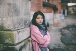 scared teen on street - socioeconomic representation