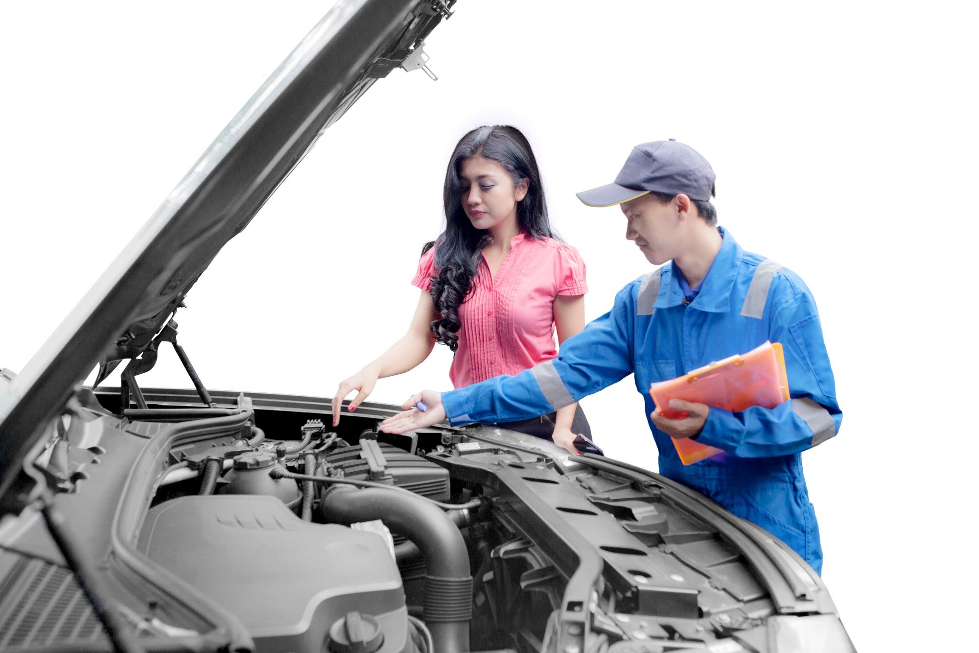 woman with mechanic looking at engine of broken car