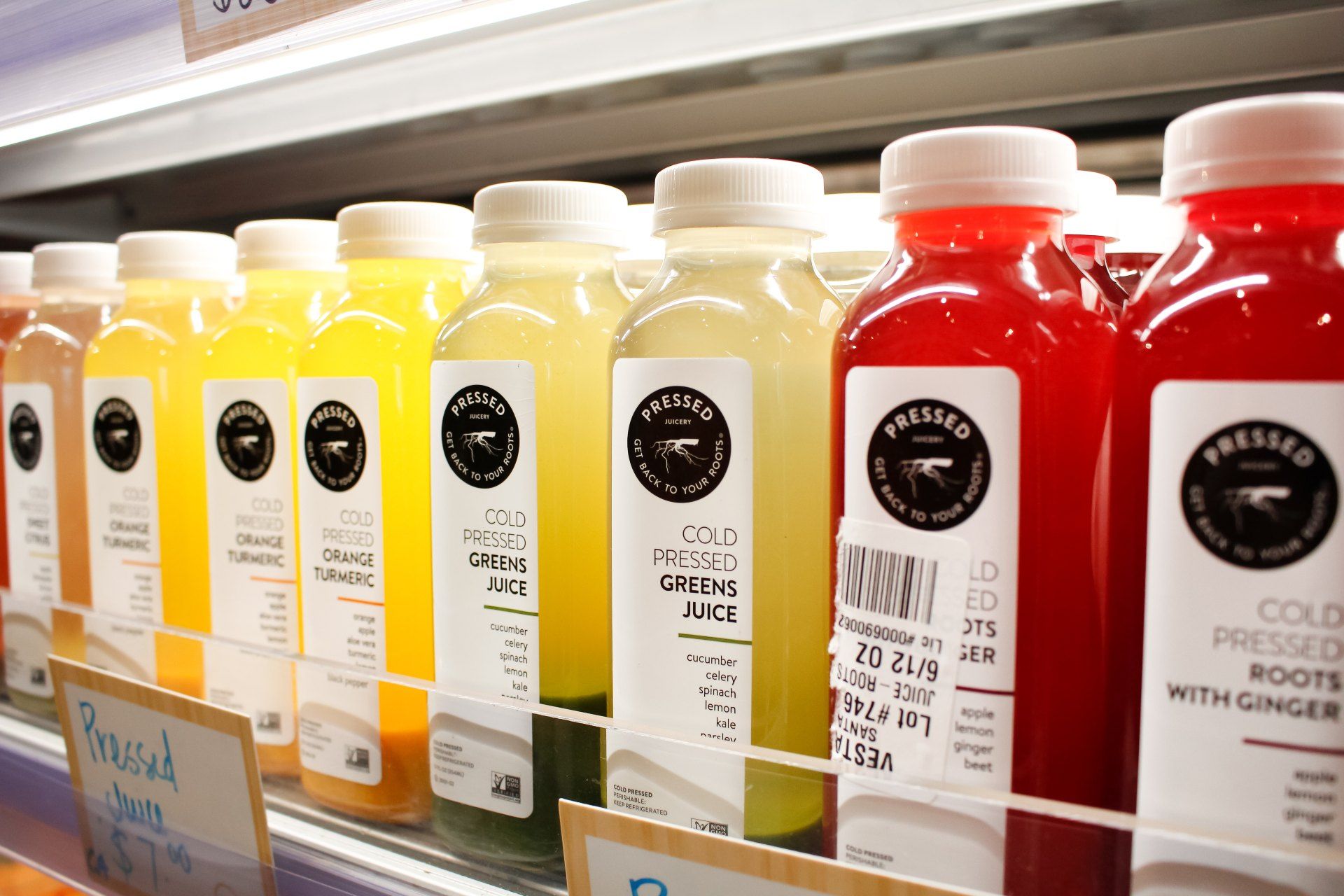 Pressed Juicery Green Juices are seen in the refrigerated section of a store