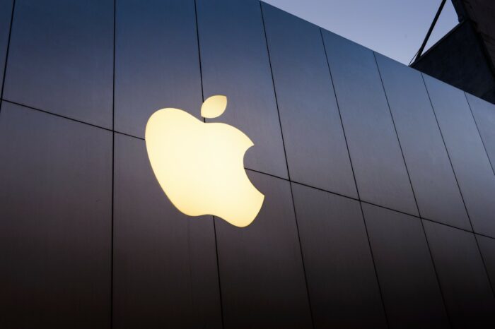 Apple logo on building — class action, antitrust, settlement