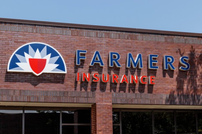 Framers Insurance sign on brick building - Farmers Insurance settlement - property loss claims - truck insurance exchange -farmers class action lawsuit