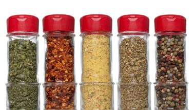 Spices in glass bottles with red lids - McCormick all-natural
