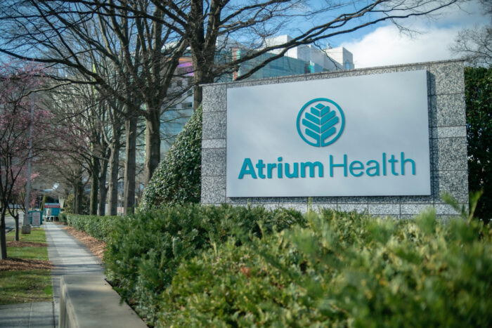 Atrium Health Carolinas Medical Center sign and logo, surgical mesh, settlement