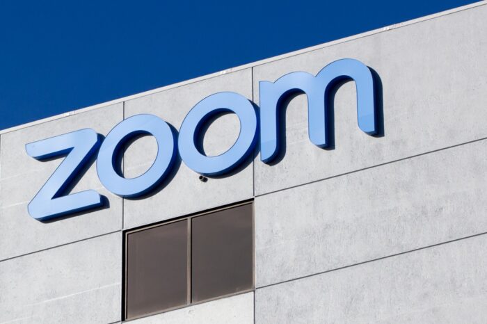 Zoom sign on building - zoom-bombing - zoom class action - zoom video conferencing