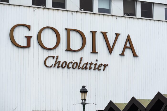 Facade and sign of the Godiva Chocolatier chocolate factory - godiva chocolates - godiva class action