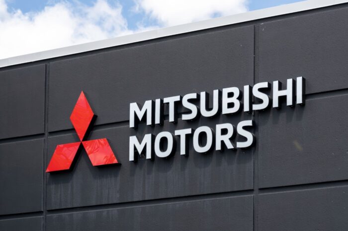 Close up of Mitsubishi Motors sign - fuel injector antitrust - fuel injector price - Fuel injection systems
