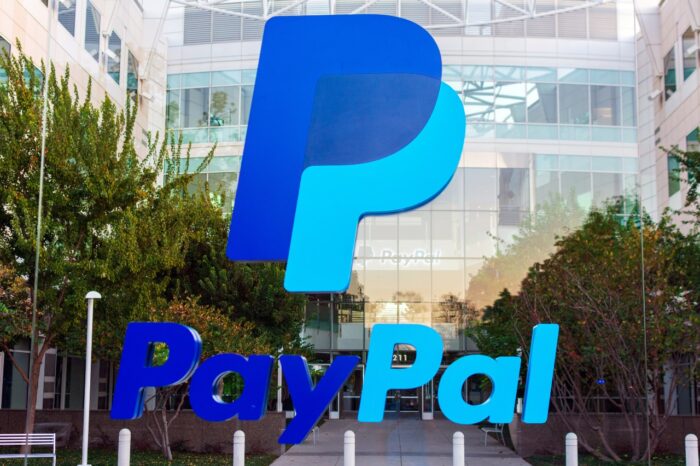 PayPal logo in front of PayPal Holdings headquarters building