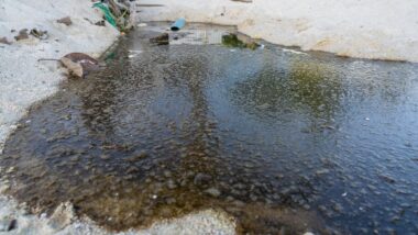 sewage and wastewater drain on sand beach
