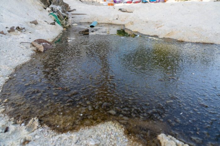 sewage and wastewater drain on sand beach