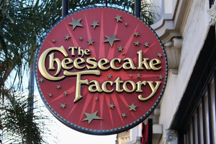 A sign for The Cheesecake Factory - Cheesecake factory settlement