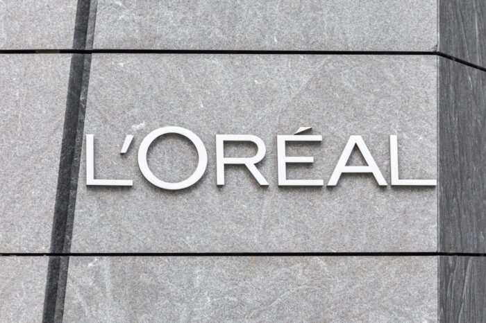 The L’Oréal logo is seen on a wall, representing the L’Oréal waterproof mascara class action lawsuit.