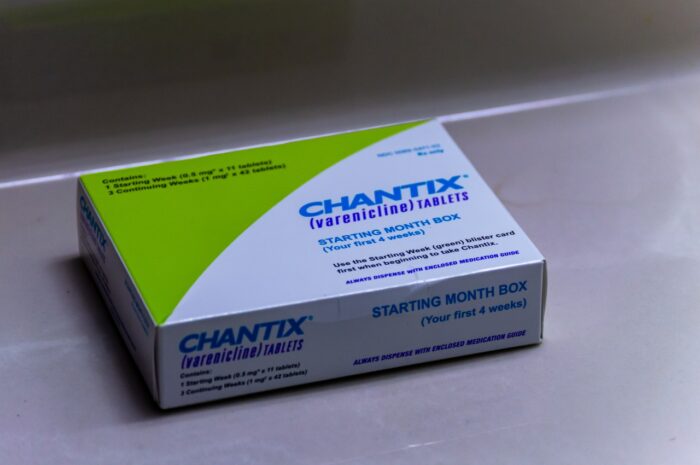 A box of Chantix medication on a counter.
