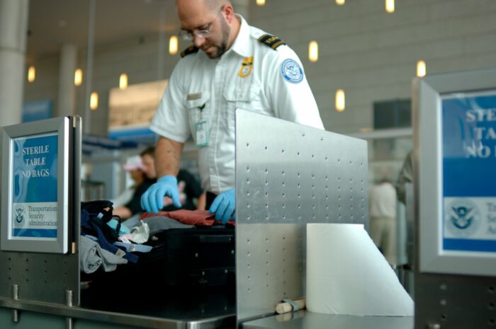 A TSA employee advises travelers that liquids are not allowed through the  gate at at the Los Angeles International Airport Wednesday, Oct. 10, 2012.  In an age when travelers have to toss