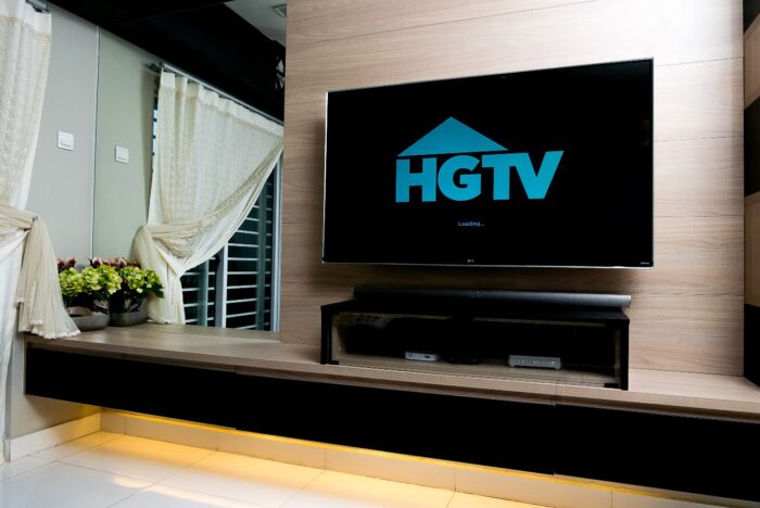 TV display HGTV app over dark background.