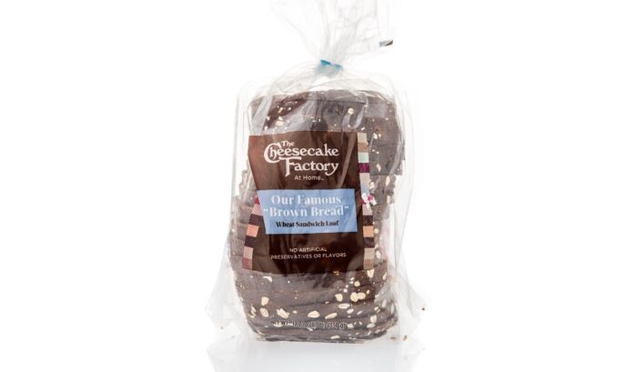 A package of The Cheesecake Factory brown bread wheat sandwich loaf on an isolated background - bimbo bakeries