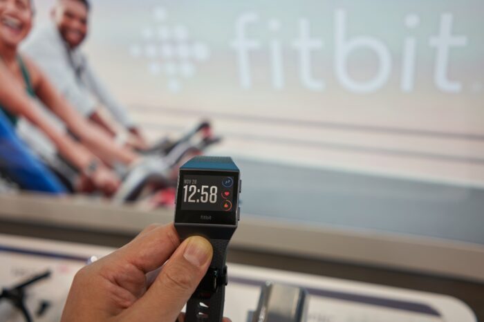 A shopper takes a closer look at a Fitbit Ionic Smartwatch in a Best Buy store in Vancouver.