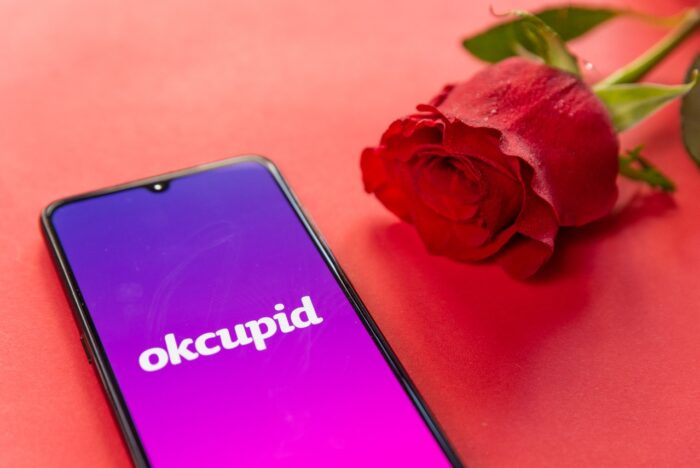 okcupid dating app logo closeup on mobile phone