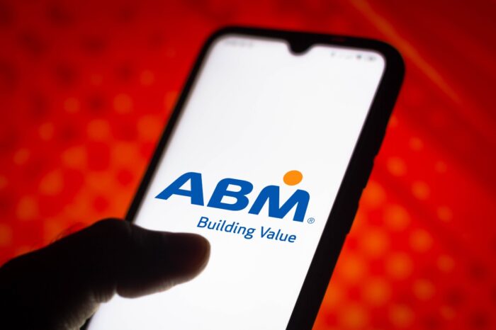 In this photo illustration a ABM Industries logo seen displayed on a smartphone