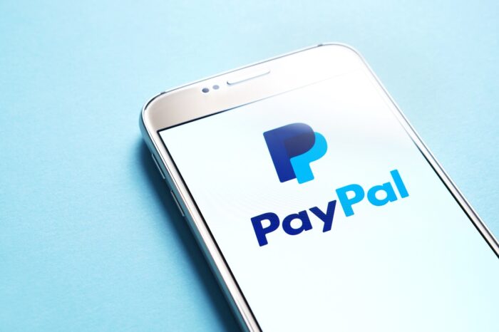 Paypal logo on smartphone screen.