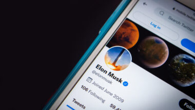 Conceptual closeup Elon Musk twitter account on iPhone