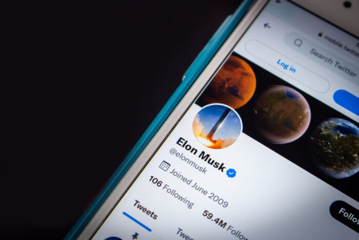 Conceptual closeup Elon Musk twitter account on iPhone