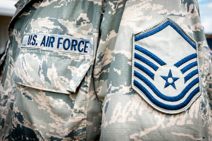 Detail of United states air force soldier's uniform with emblem in focus.