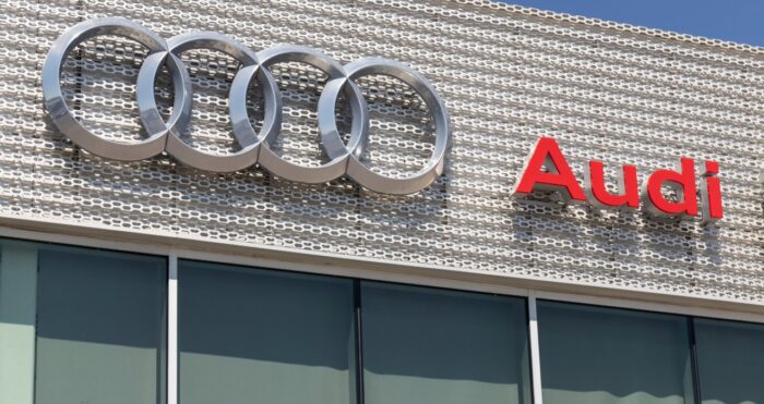 Audi automobile dealership sign - audi transmission settlement - audi class action lawsuit