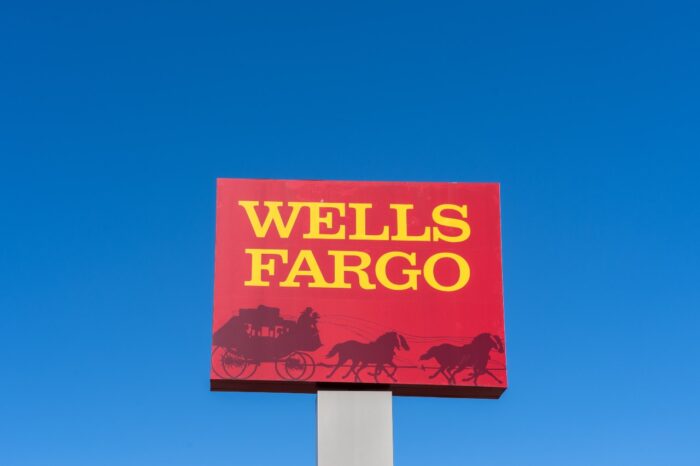 Wells Fargo pole sign with blue sky in background.