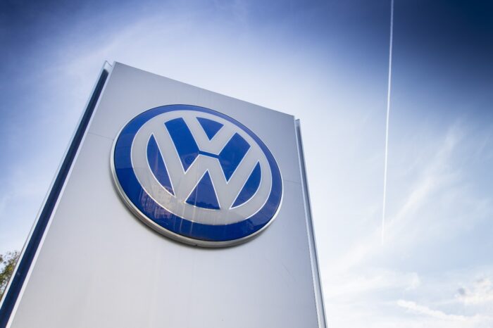 Volkswagen car maker logo on a sign of dealership
