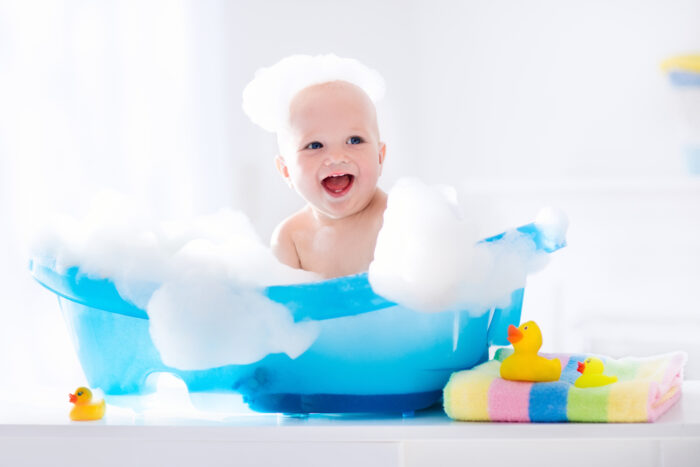 A baby taking a bubble bath