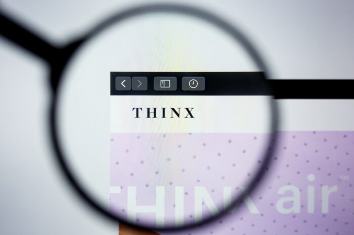 Thinx website homepage. Thinx logo visible on display screen.
