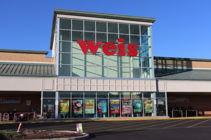 Photo of exterior Weis supermarket building .