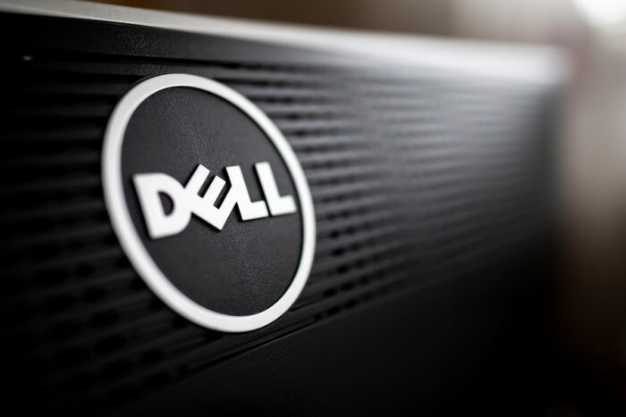 Close-up of Dell company logo on the back of a professional black monitor in natural light.