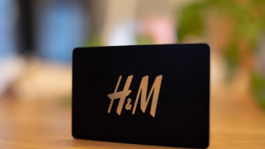 Black H and M gift card with golden letters.