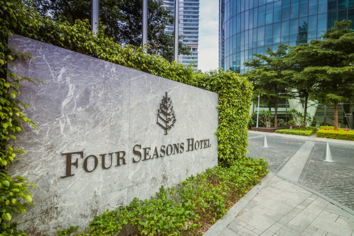 Photo of Four Seasons Hotel exterior sign.