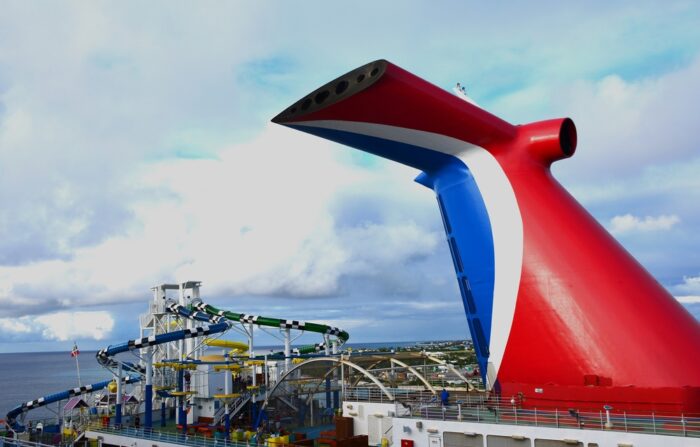 The upper deck of a Carnival Cruise ship filled with water slides and activities - settlement