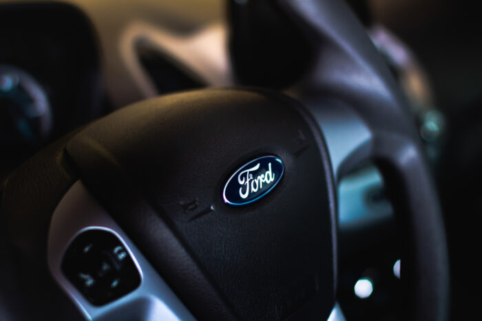 Close up of Ford logo on a steering wheel.