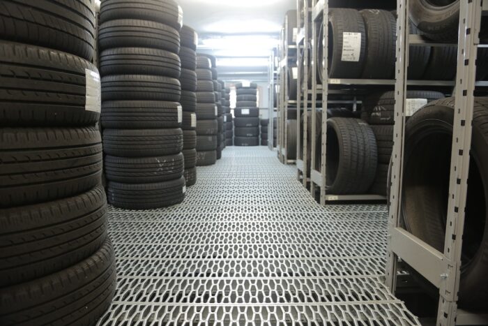 Stacks of new tires in a tire shop - goodyear recall