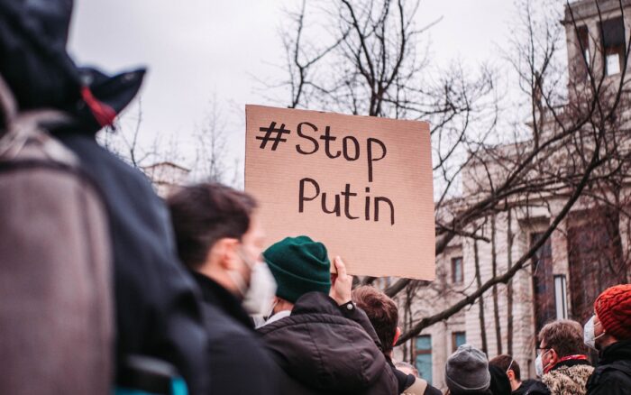 People in the streets protesting against war. A sign reads '#Stop Putin.' - Ukraine - civil action