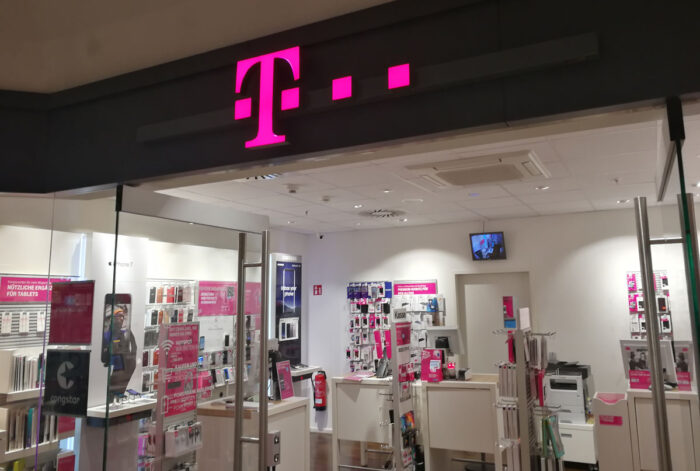 Exterior of a T-Mobile store inside of a mall - class action, 5g
