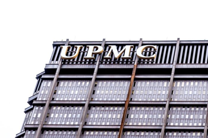 UPMC sign on the building in Pittsburgh. The University of Pittsburgh Medical Center (UPMC) is a integrated global nonprofit health enterprise - UPMC class action lawsuit, upmc data breach settlement