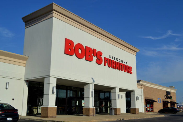 Exterior of a Bob's Discount Store against a blue sky.