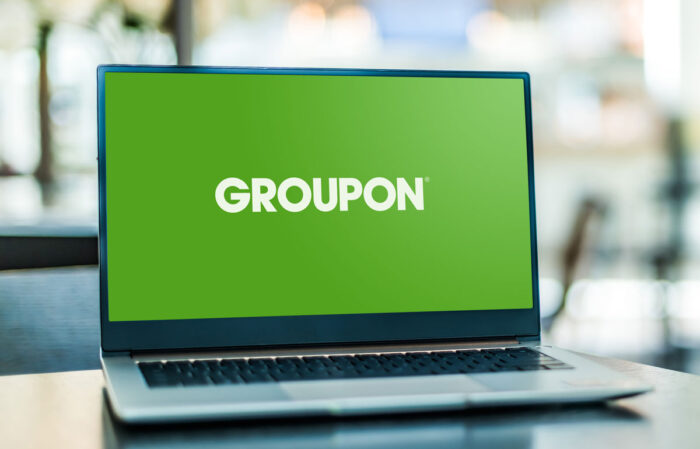 Laptop computer displaying logo of Groupon.