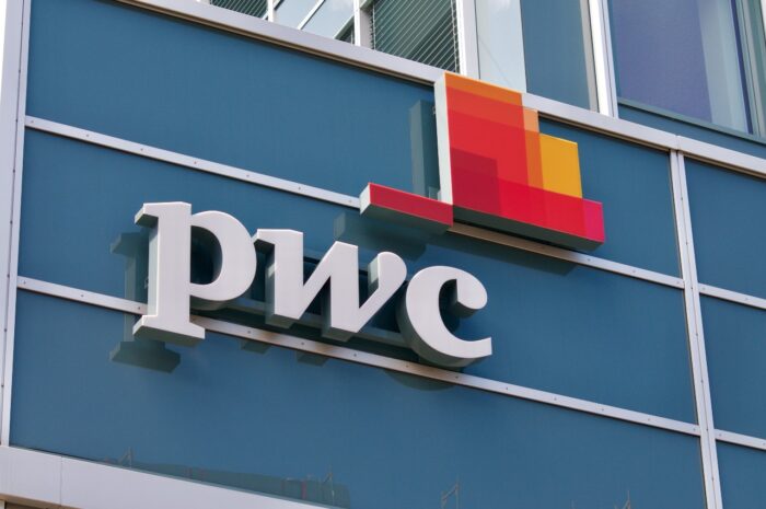 PwC sign on building - pwc age discrimination, settlement