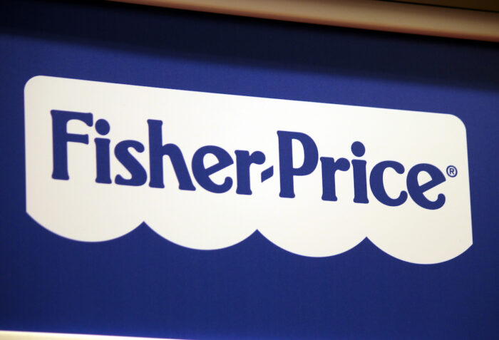 Close up of Fisher-Price logo on a storefront banner.