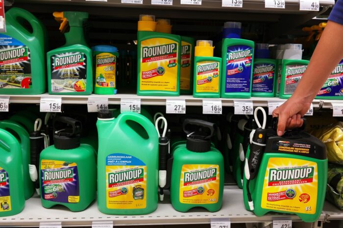 Shelves with a variety of Herbicides in a Carrefour Hypermarket. Roundup is a brand-name of an herbicide containing glyphosate, made by Monsanto Company.