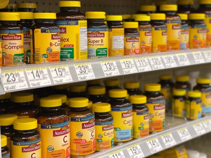 A selection of Nature Made vitamins at a Walgreens pharmacy.