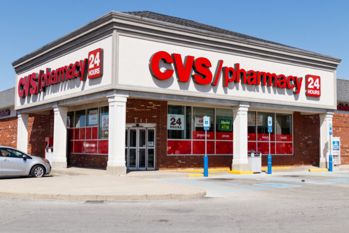 Exterior of a CVS store against a blue sky.