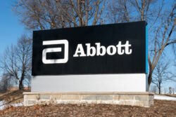 Exterior image of Abbott signage on a hill against a blue sky. baby formula, baby formula shortage update.