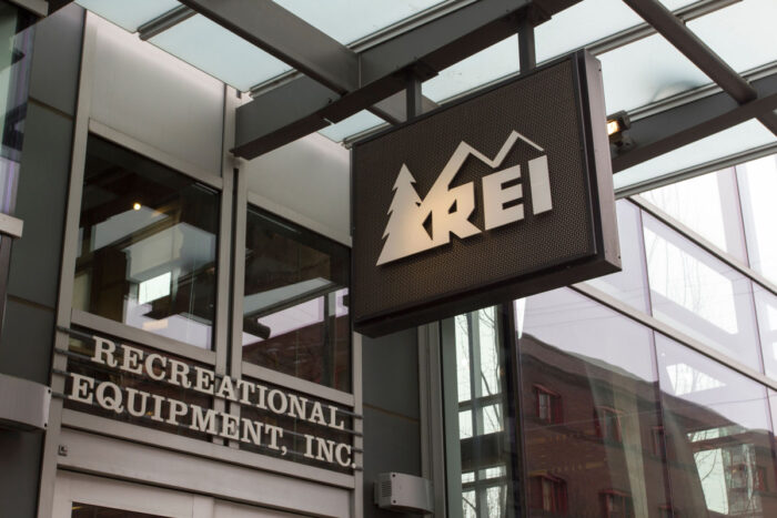The REI sign at the entrance of its store in Portland.